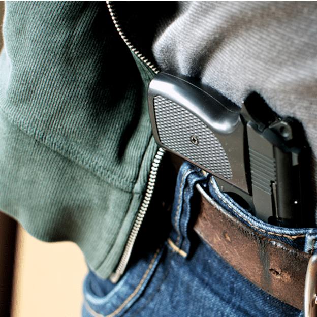 Tucked in a belt pistol being concealed