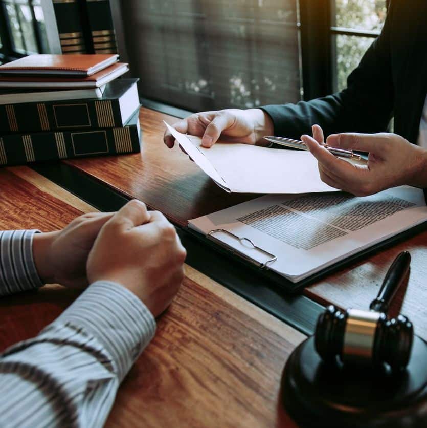 Clients come to seek advice for the law regarding privacy violations with the lawyer at the office.