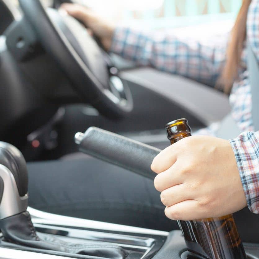 This woman eats beer while driving