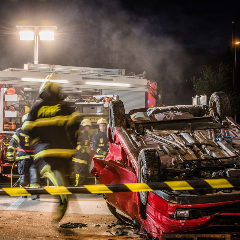 Firefigters at a car accident scene